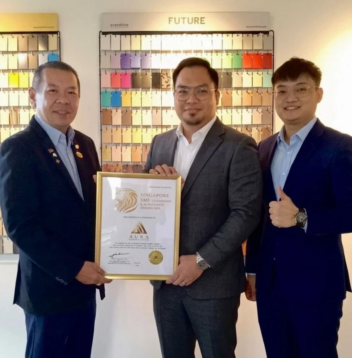 Aura Design & Co. receiving the Singapore SME Leadership & Achievement Award